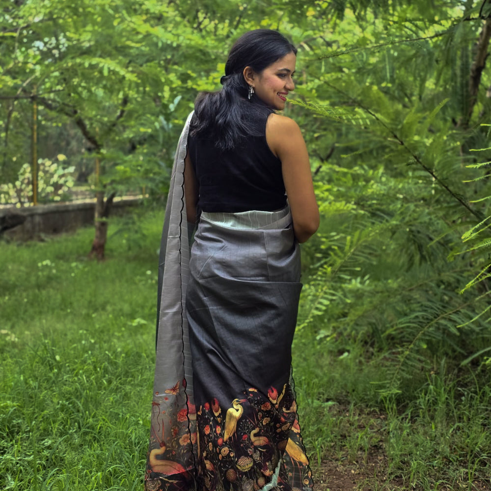 
                      
                        Model wearing Hahim Tussar silk saree by Apaapi, handwoven in Assam and inspired by the Great Hornbill of Kaziranga. Elegant animal-motif saree in earthy silk tones symbolizing grace and freedom
                      
                    