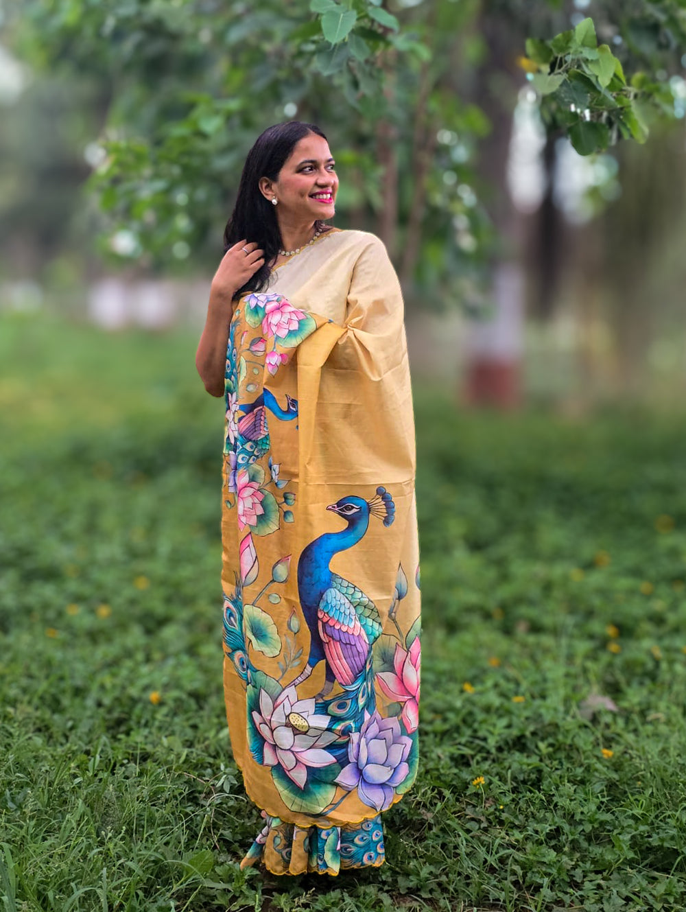 Model wearing Bonbaha Tussar silk saree by Apaapi, handwoven in Assam with animal-inspired motifs and earthy tones reflecting Kaziranga’s wetlands and peacocks