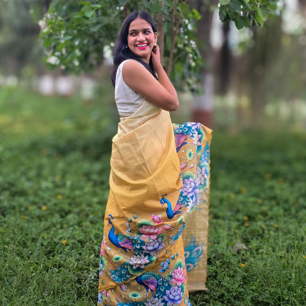 
                      
                        Model wearing Bonbaha Tussar silk saree by Apaapi, handwoven in Assam with animal-inspired motifs and earthy tones reflecting Kaziranga’s wetlands and peacocks
                      
                    