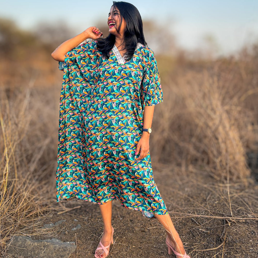  Crepe Kaftan Dress inspired by Water Hyacinth in tropical lagoons. Free-flowing and stylish, offering comfort and elegance. Perfect for all occasions with a unique vibrant floral print. #CrepeKaftan #TropicalFashion #WaterHyacinthPrint #SummerStyle