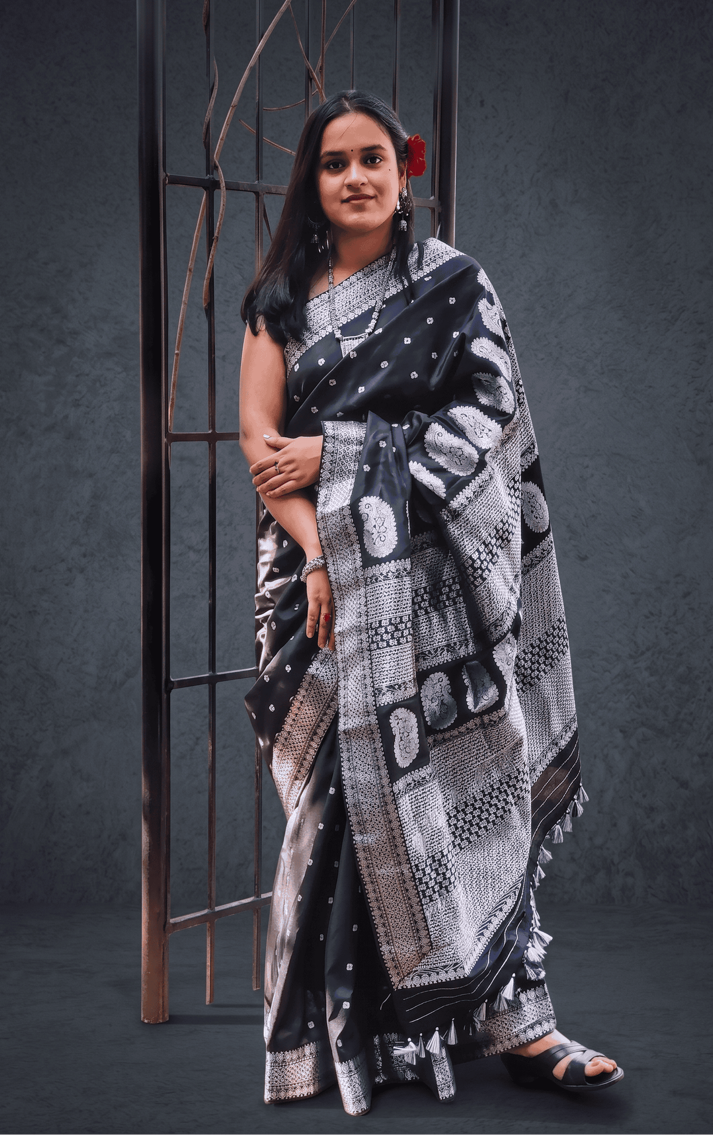 Close-up detail of silver zari motif on Baatori black silk saree