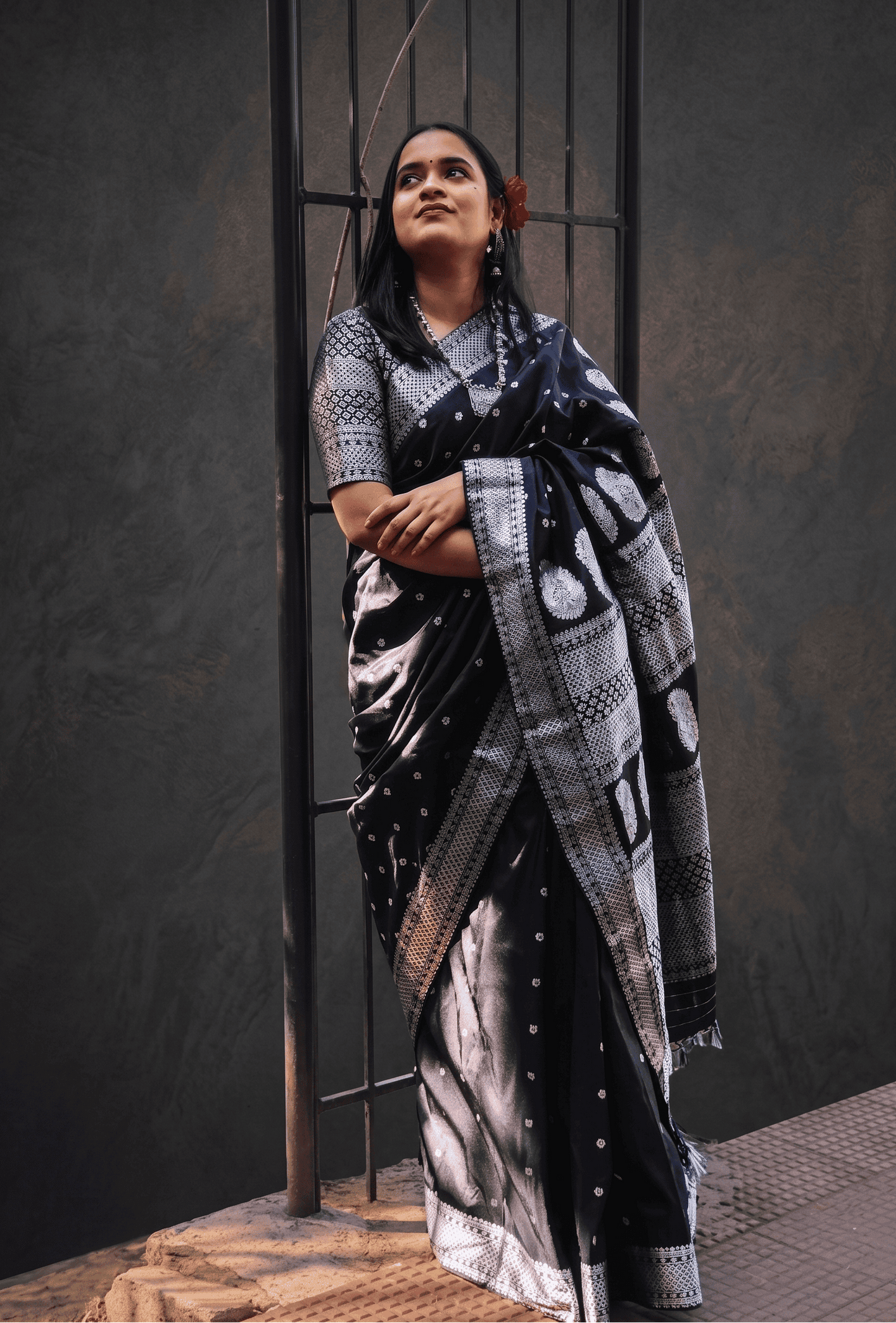 Side view of Baatori black silk saree with silver zari motif and elegant festive styling