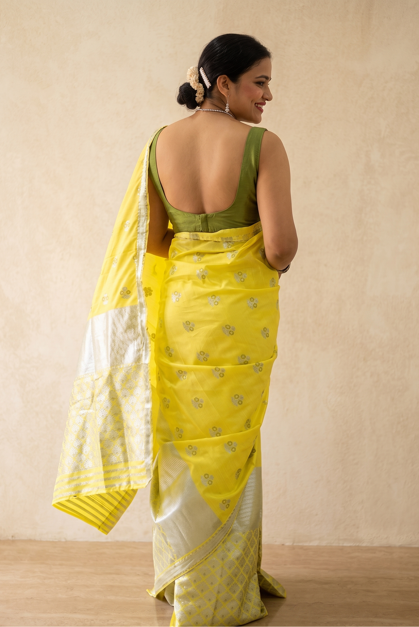 Back drape of Bihuwoti yellow silk blend Mekhela Chador from Assam