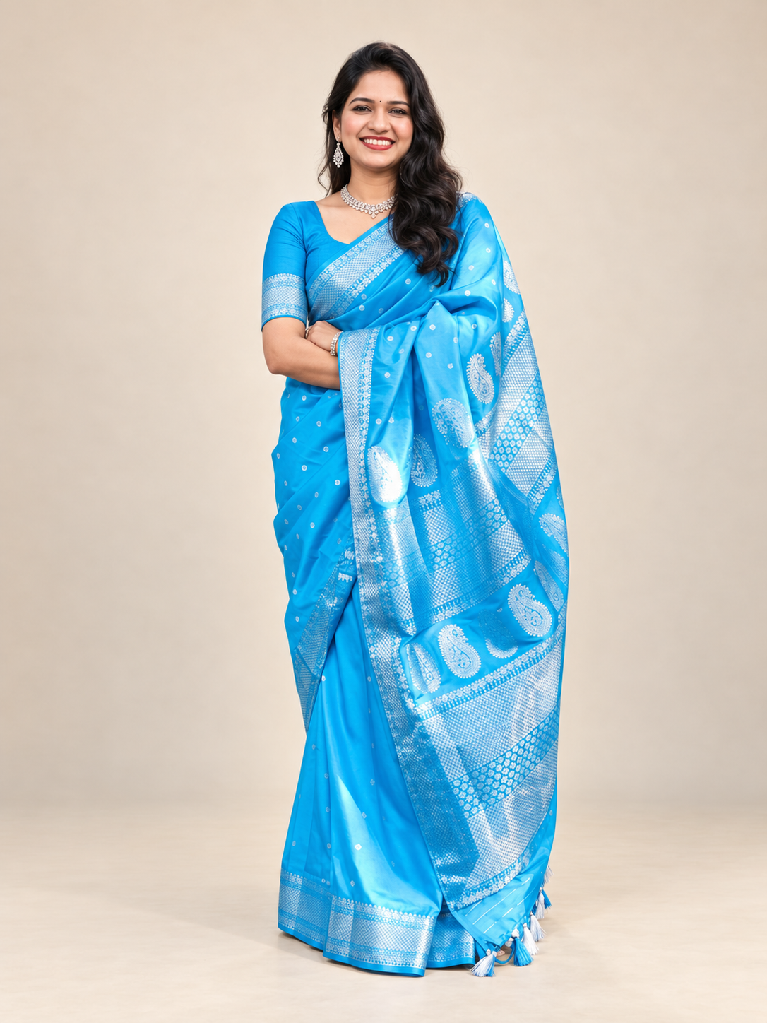 Front view of a blue and silver saree with ornate woven pallu and border styled for Indian weddings and festive celebrations.