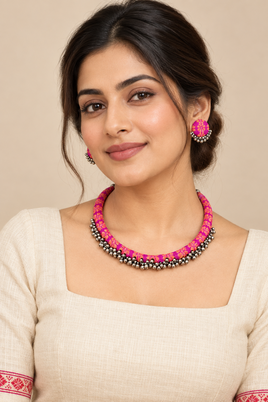 Model wearing Champavati magenta textile necklace and matching earrings