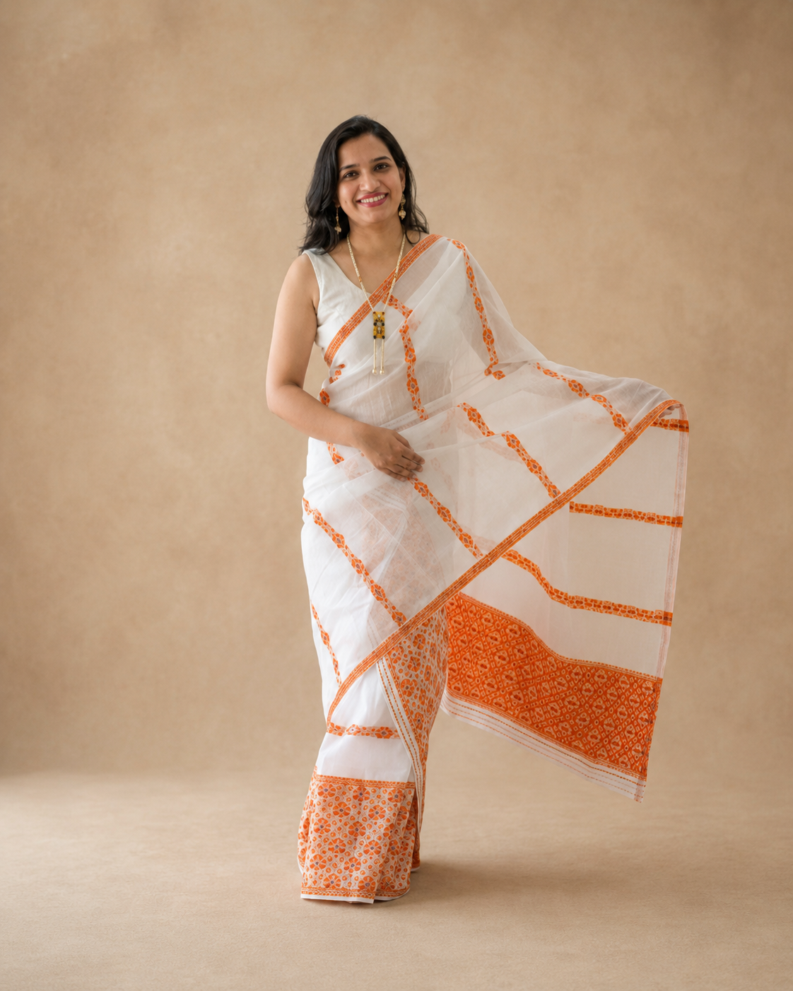Chandralekha white cotton mekhela chador with orange motif front view