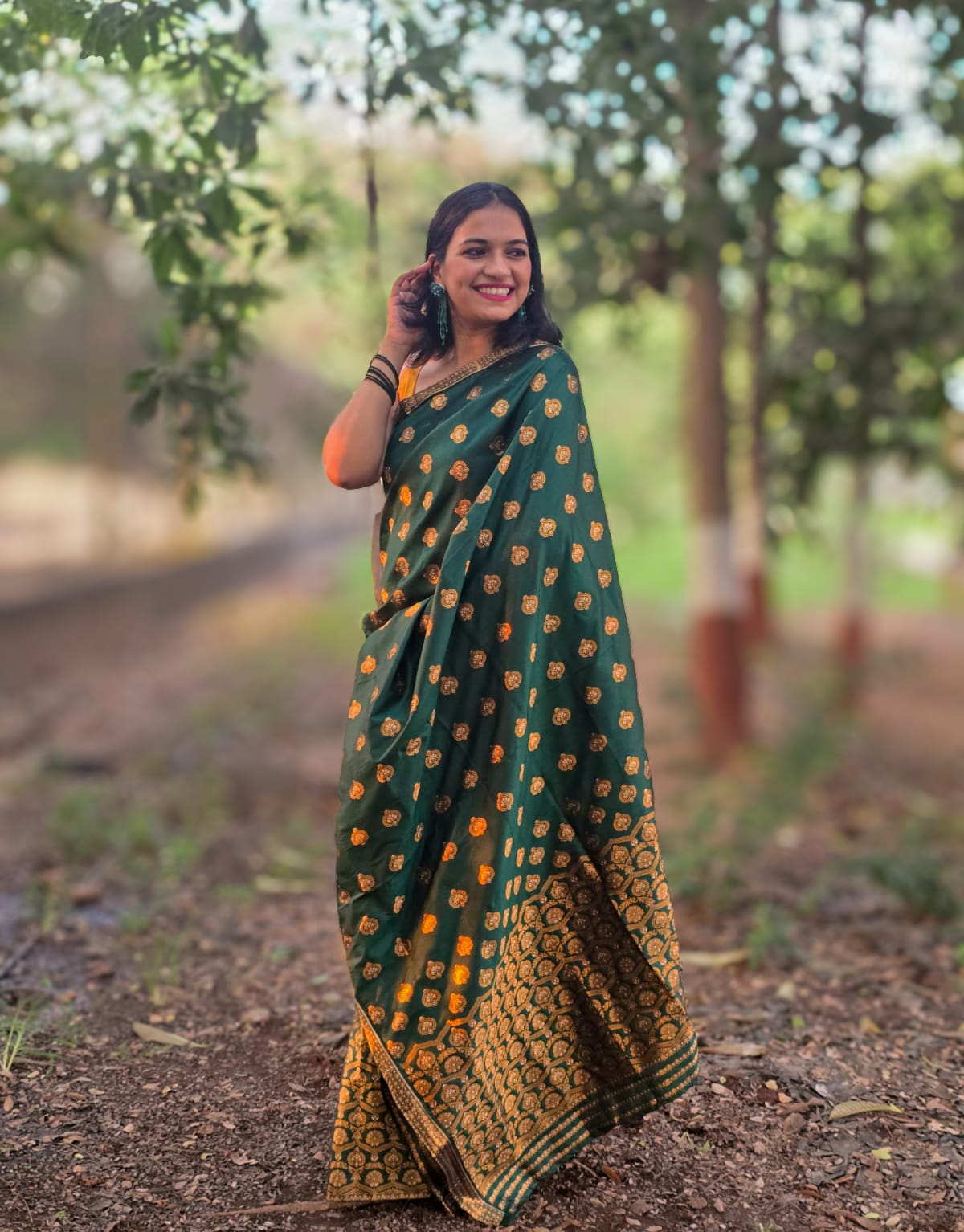 Handwoven green mixed silk Mekhela Chador from Assam with golden woven motifs