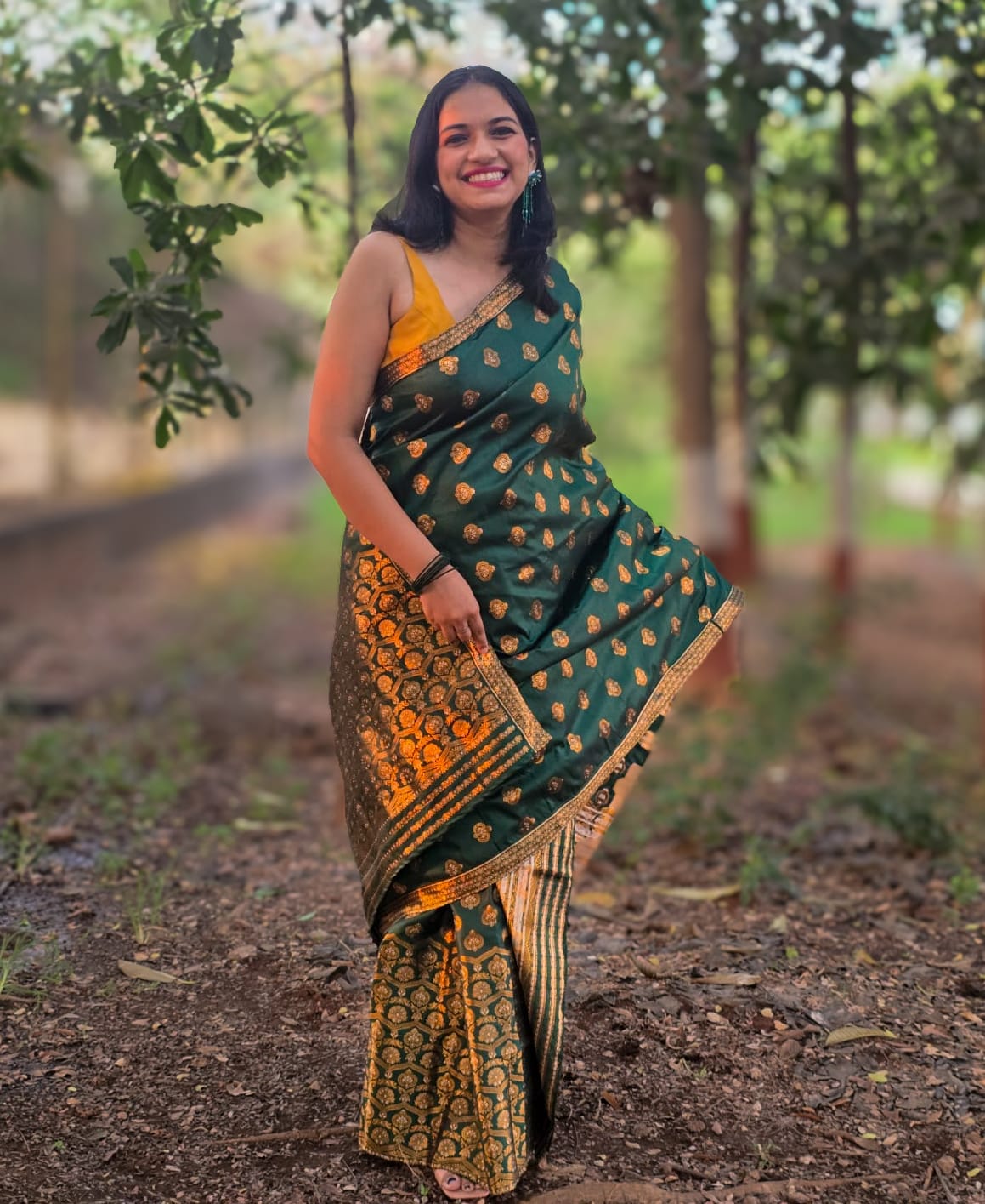Handwoven green mixed silk Mekhela Chador from Assam with golden woven motifs
