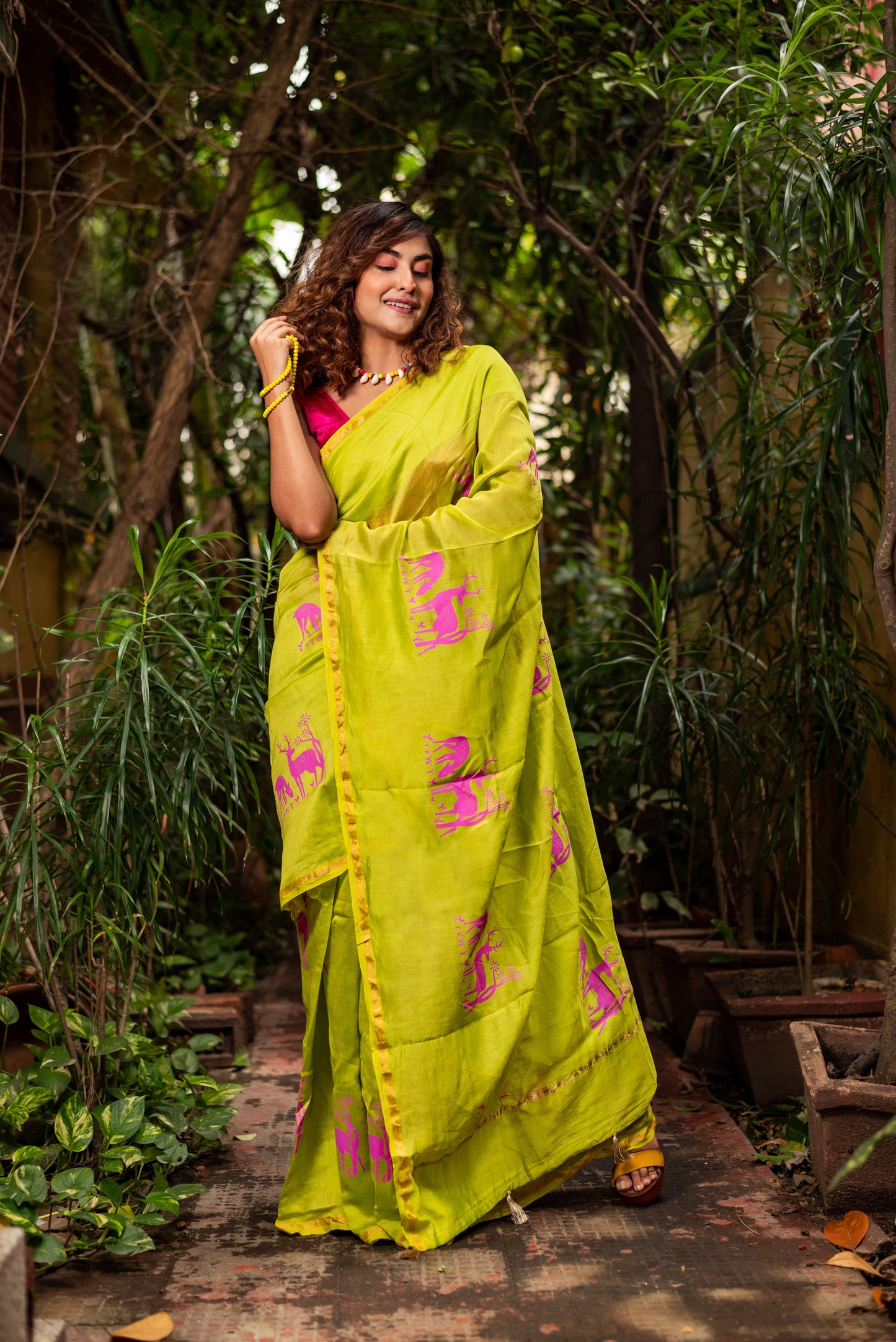 Horin Bon green Chanderi silk cotton saree by Apaapi inspired by Assam forests and deer motifs.
