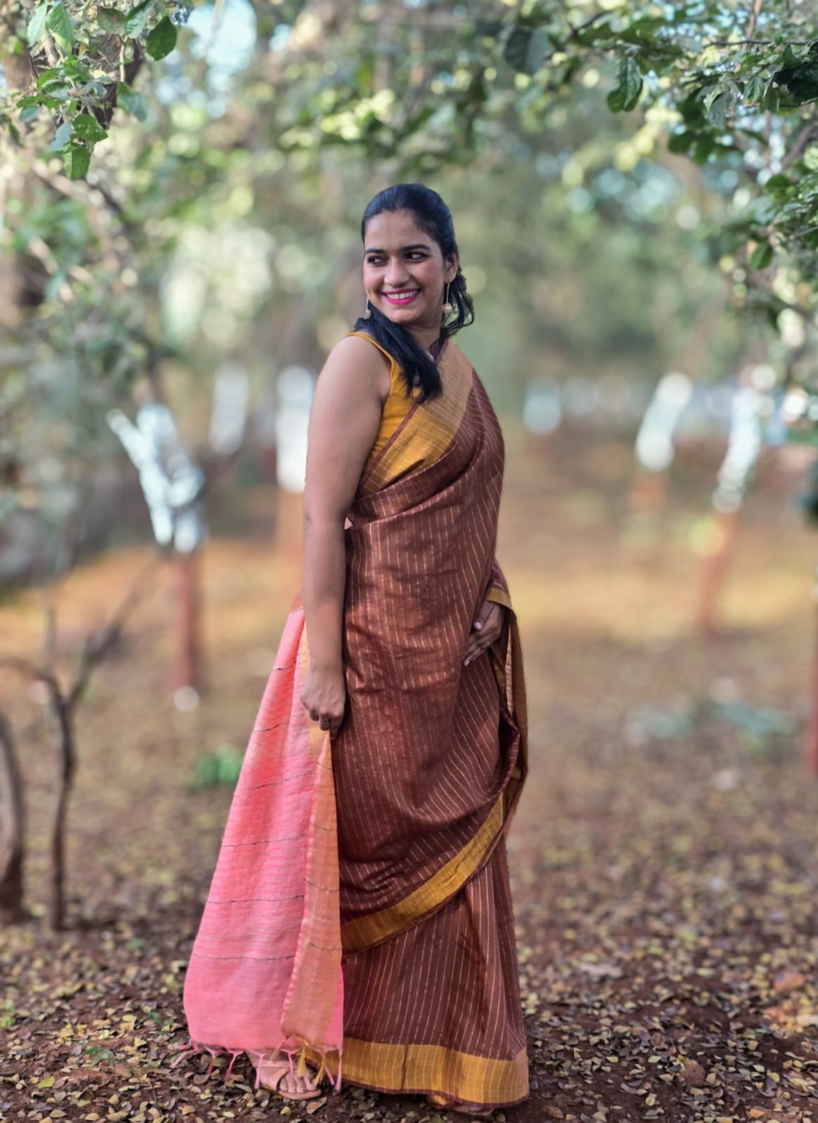 Mati Rekha brown silk cotton saree with mustard border and coral pallu inspired by Assam