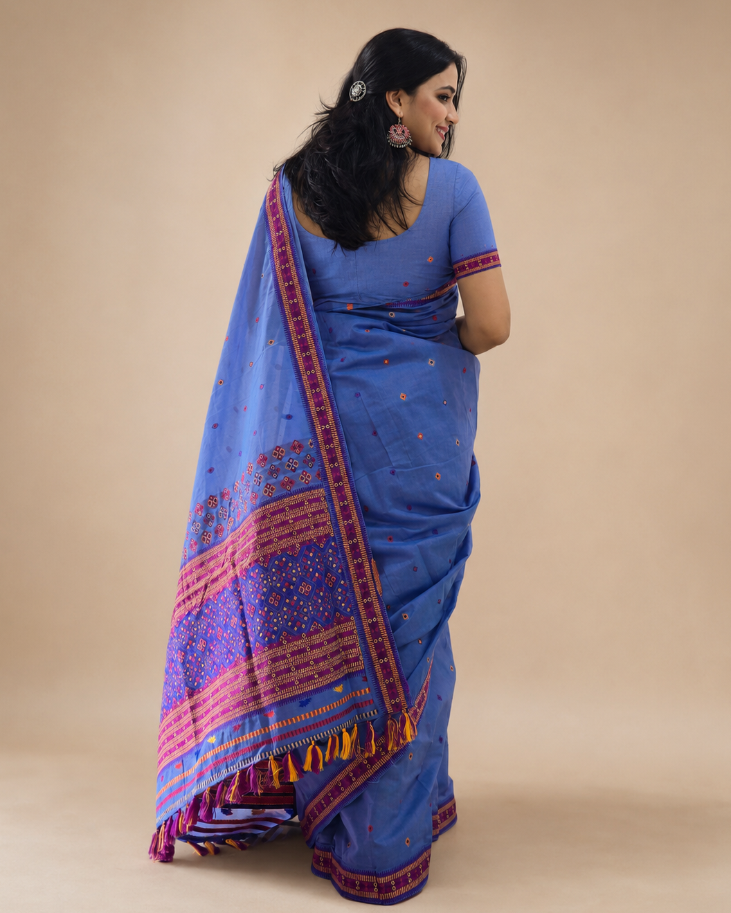 Mon soft blue handwoven cotton saree from Assam styled in a contemporary full drape.