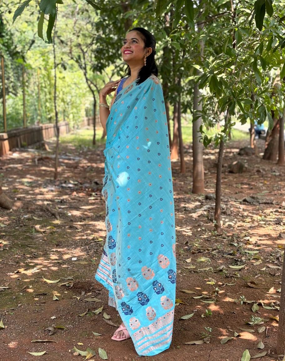 Handwoven sky blue Mekhela Chador from Assam with floral woven motifs