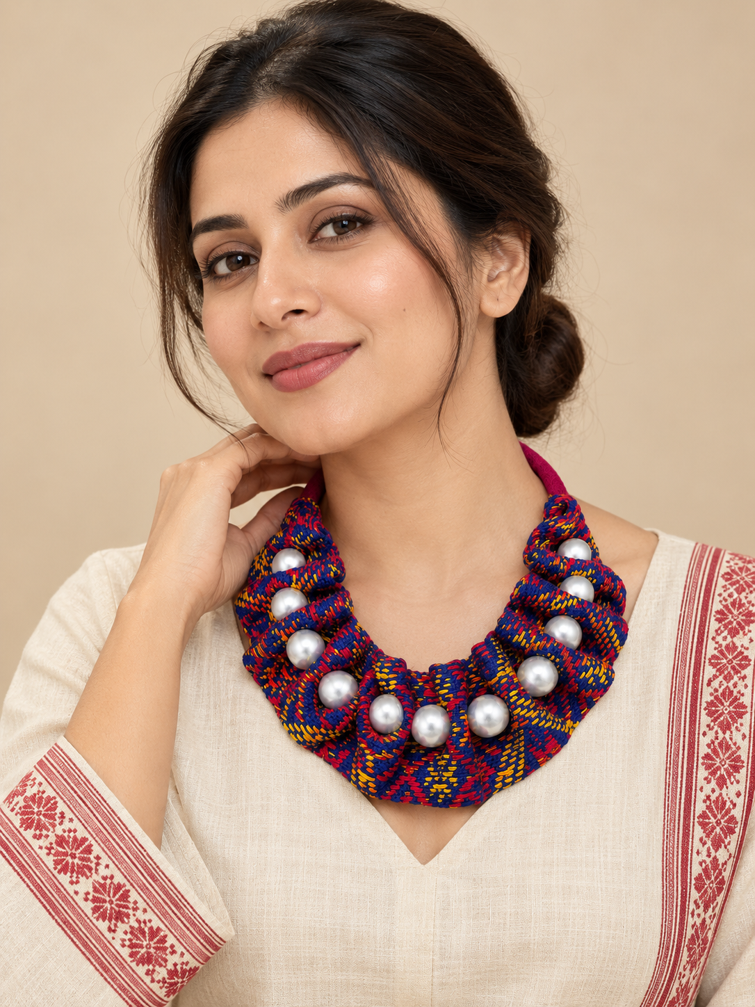 Model wearing Ou Kuwori blue textile statement necklace handcrafted in Assam