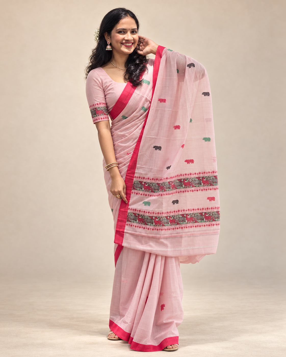 Pink Kaziranga-inspired Assam saree styled for Bihu, Assamese cultural events and festive gatherings.