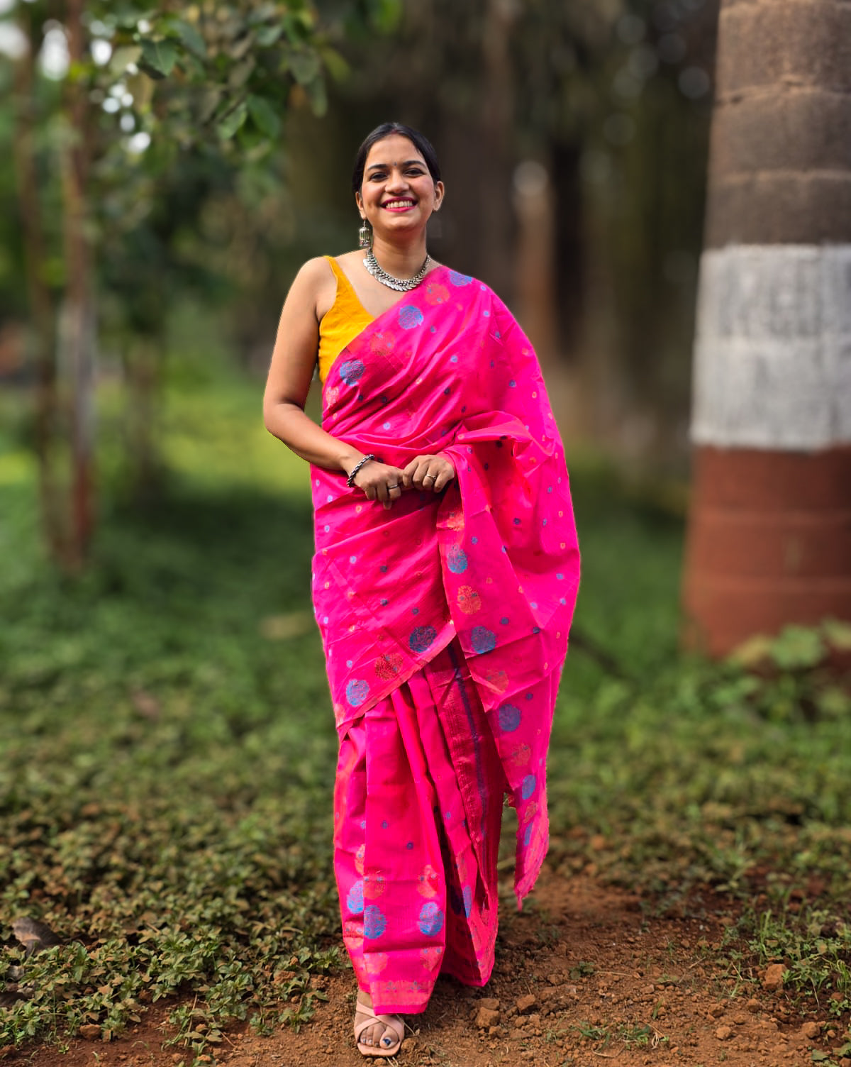 Woven pink Mekhela Chador from Assam with golden woven motifs