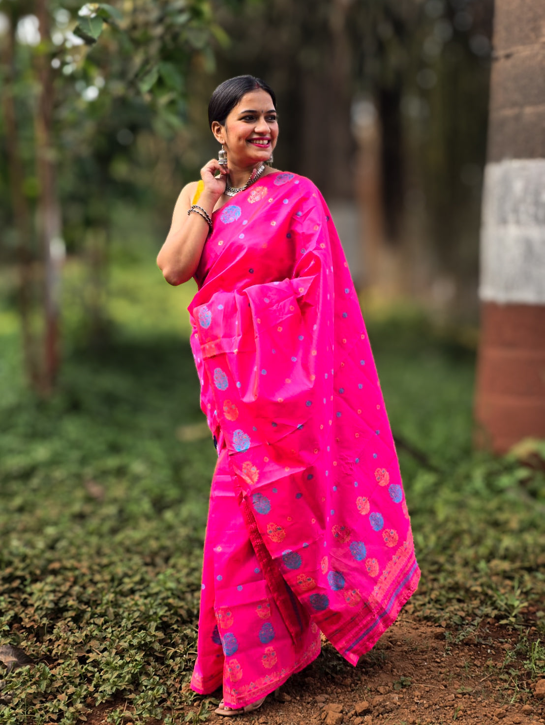 Woven hot pink Mekhela Chador from Assam with golden woven motifs