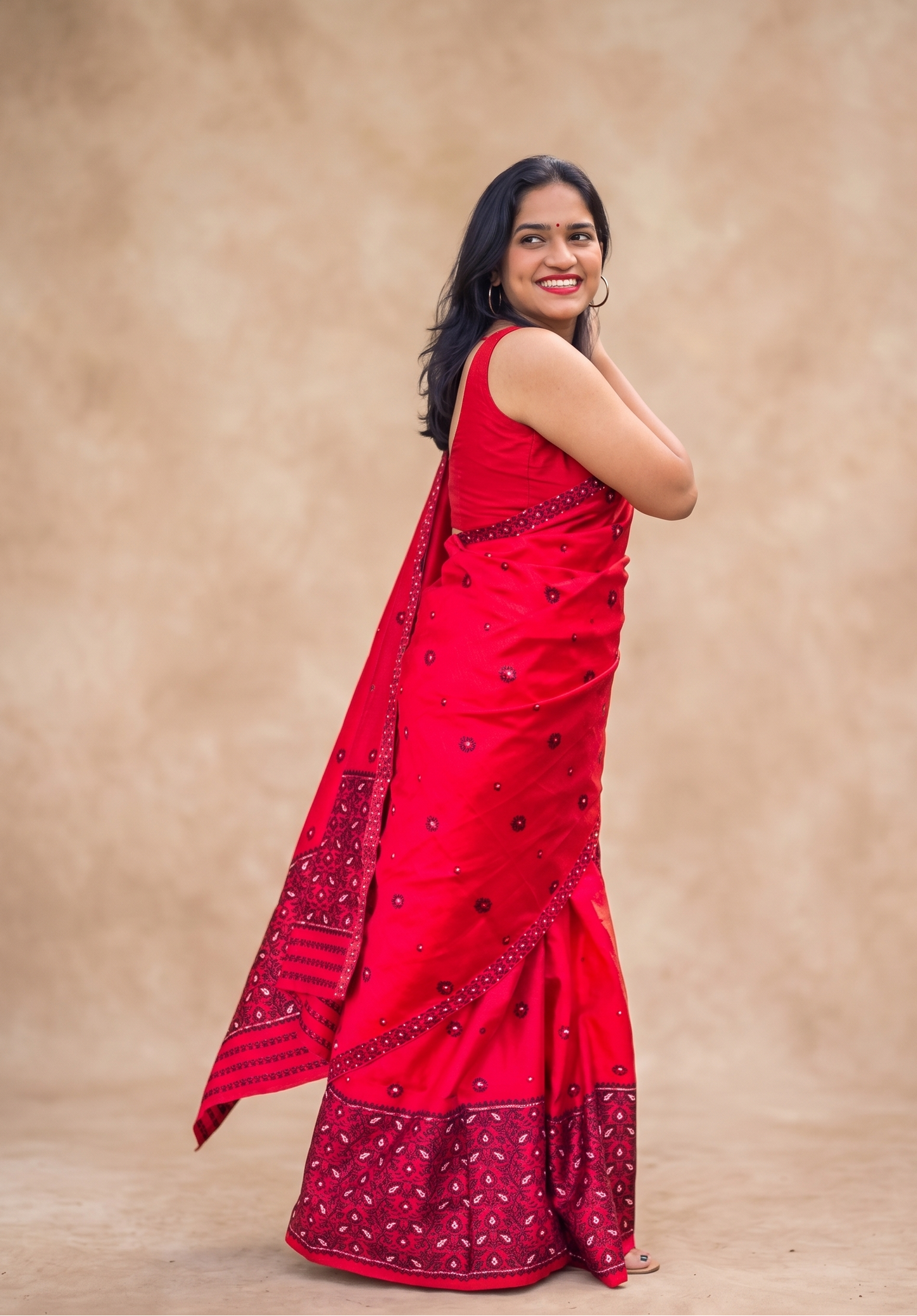 Full length look of fully stitched red mixed silk Mekhela Chador from Assam for festive wear