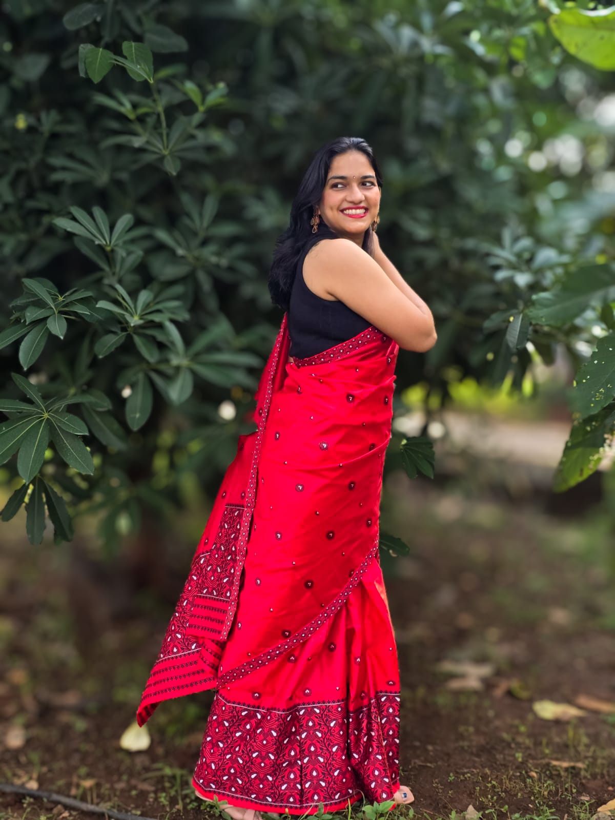 Handwoven red mixed silk Mekhela Chador from Assam with black traditional motifs