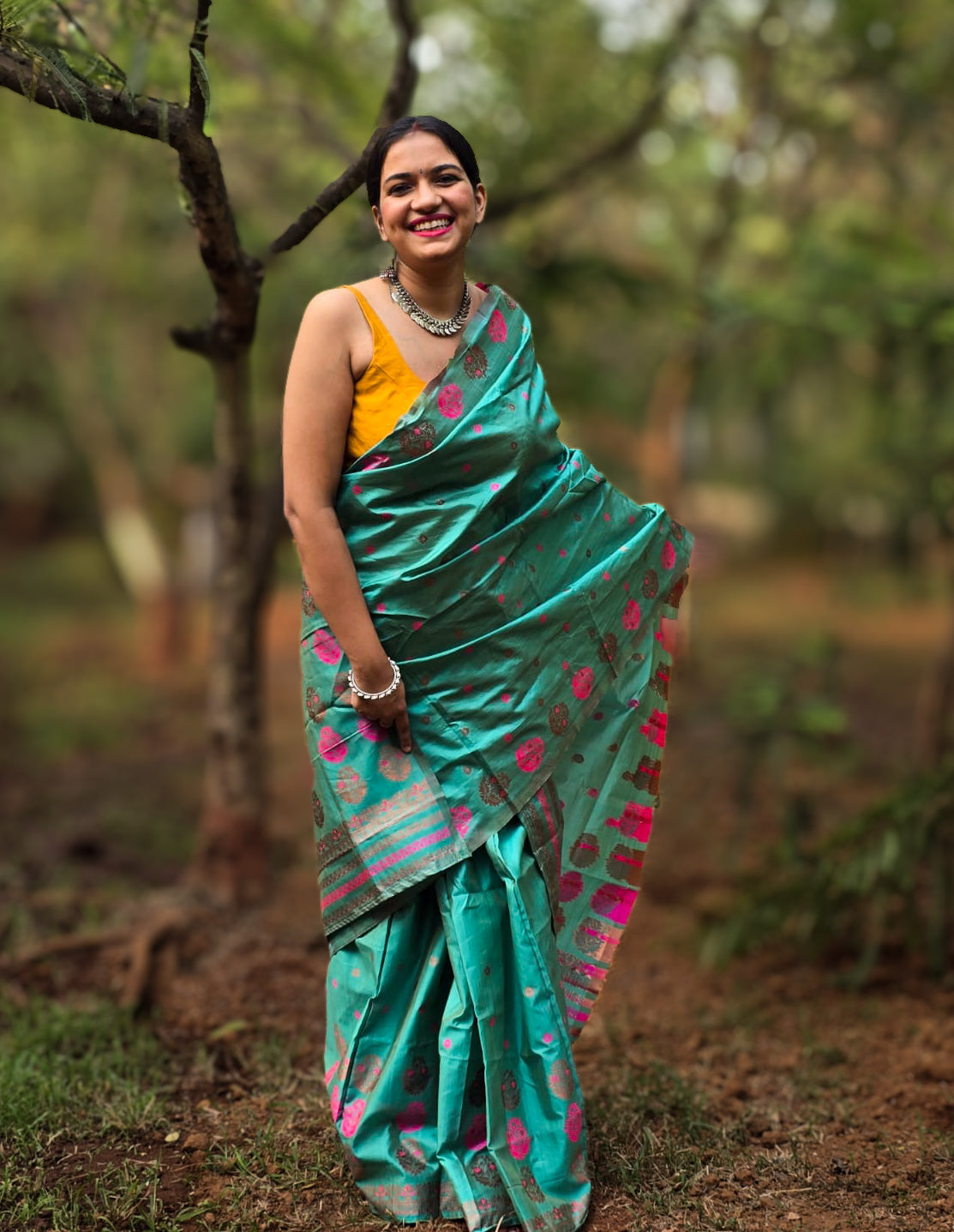 Woven teal Mekhela Chador from Assam with pink woven motifs