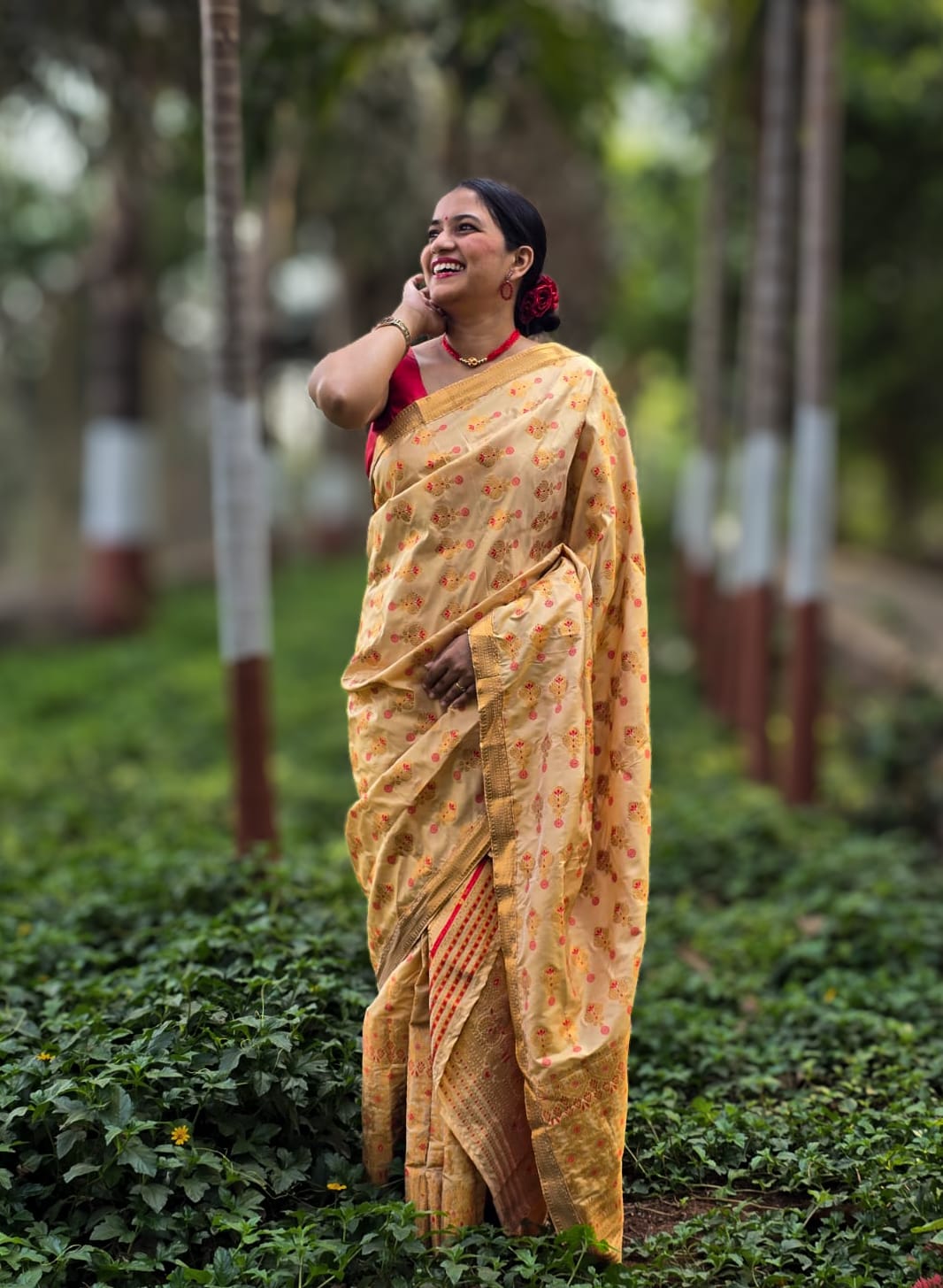 Handwoven golden yellow silk Mekhela Chador from Assam with red floral motifs