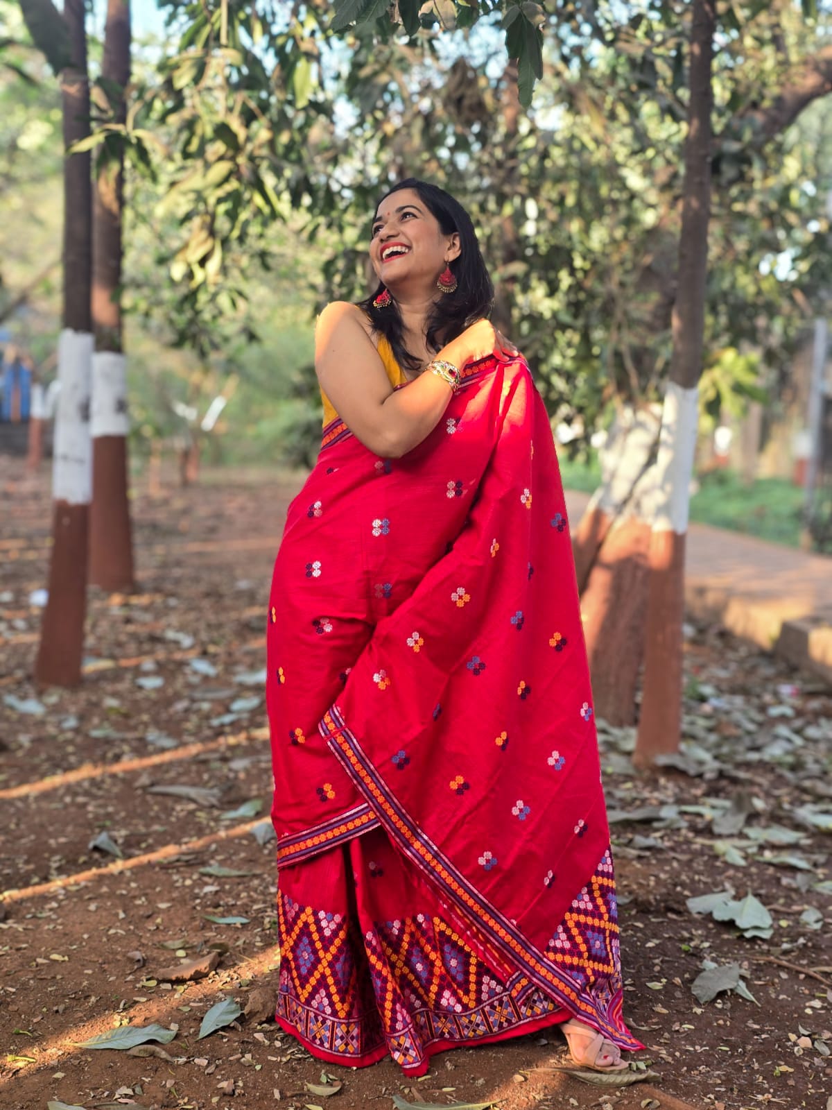 Full-length view of the Rengam Red Mishing Mekhela Chador showcasing the intricate purple and orange zig-zag 