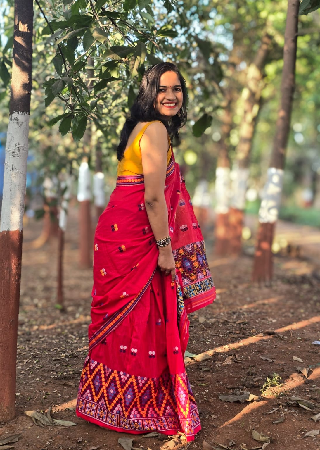 Full-length view of the Rengam Red Mishing Mekhela Chador showcasing the intricate purple and orange zig-zag 