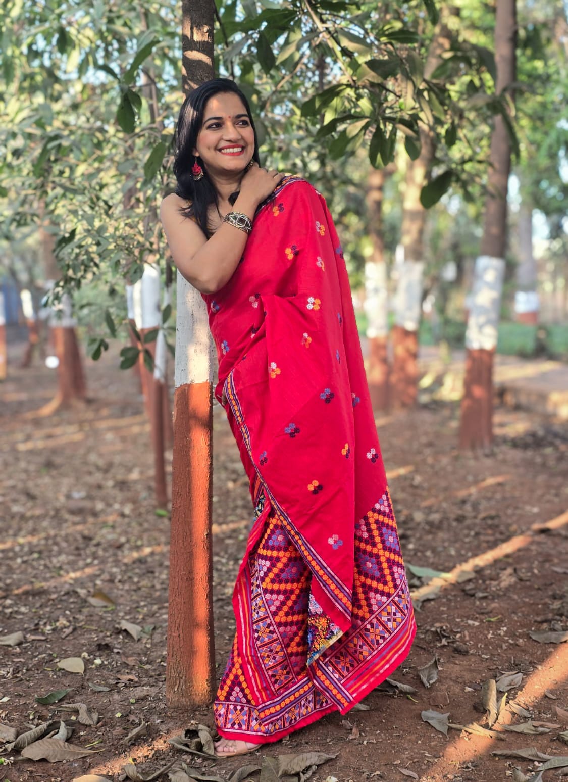 Full-length view of the Rengam Red Mishing Mekhela Chador showcasing the intricate purple and orange zig-zag 