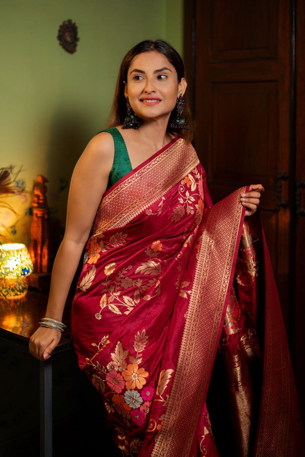 Close-up of floral design on Ujasi red Banarasi silk blend saree