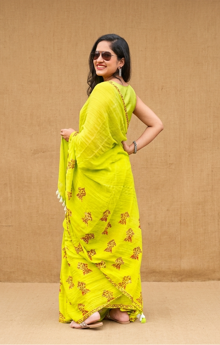 Green mulmul cotton block printed saree styled for daily wear, office wear, puja and summer outings in India