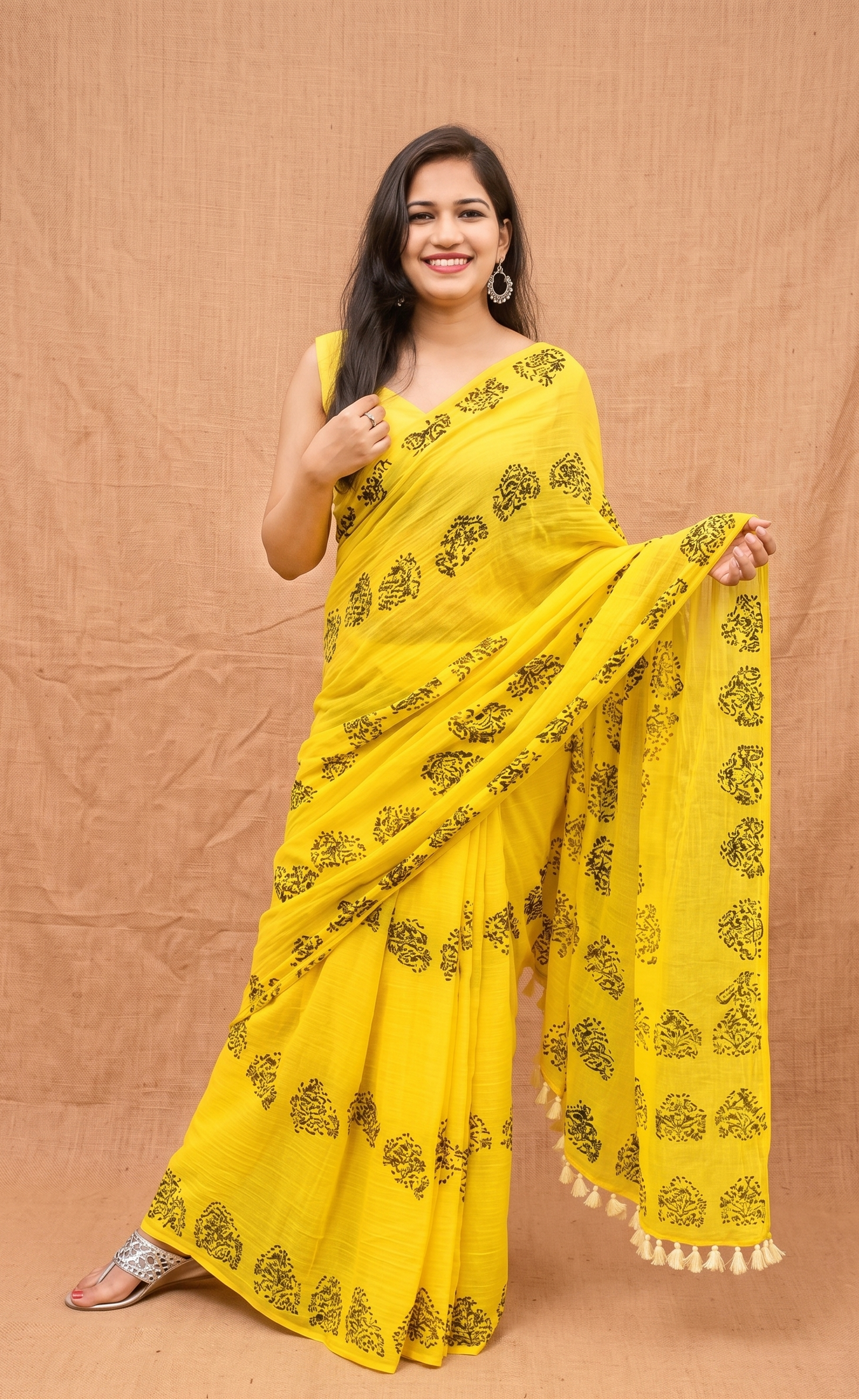 Oli yellow mulmul cotton saree with Assam dhol pepa motif by Apaapi, soft lightweight cotton saree for daily wear, office wear and summer styling in India