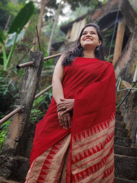 Stunning red cotton saree with muga coloured pallu and pleats handwoven with arnai motifs handcrafted for the beautiful you.